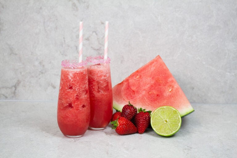 2 strawberry mocktails with pink and white striped straws