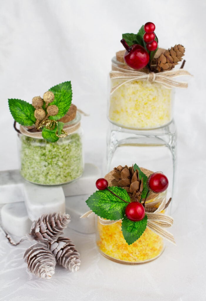 jars of lemon, lime and orange citrus salts decorated with Christmas trim