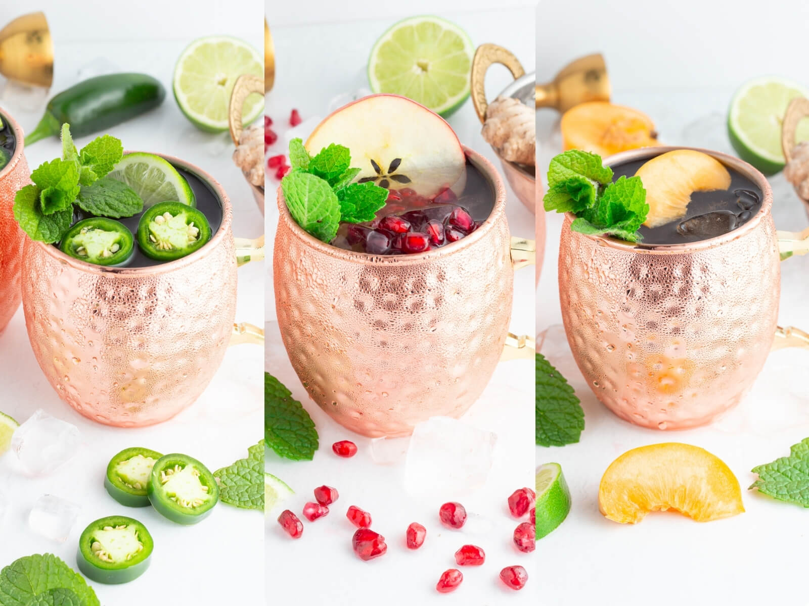 Three copper mugs filled with colorful Moscow mule mocktails, garnished with jalapeño and mint, apple and pomegranate seeds, and orange and mint. Ingredients and ice cubes are scattered around on a white surface.