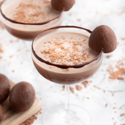 chocolate mocktail in a coupe glass with Easter egg garnish
