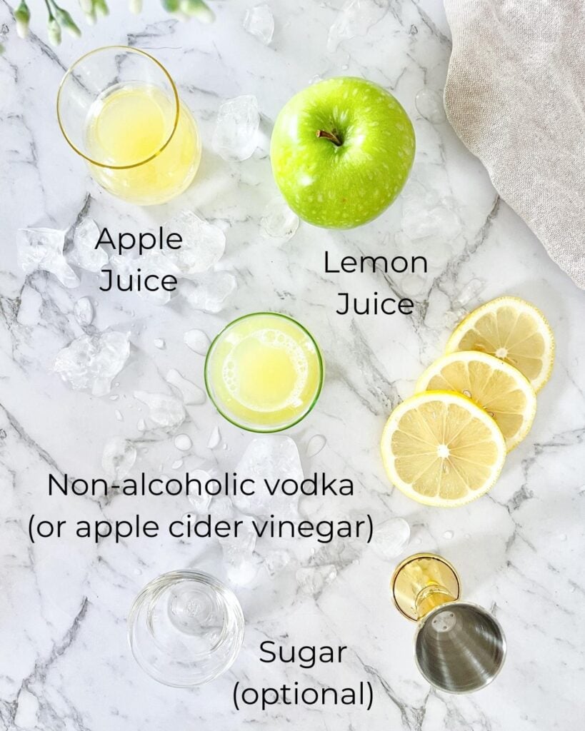 ingredients for a vodka mocktail including apple and lemon juice, non alcoholic vodka or apple cider vinegar and sugar