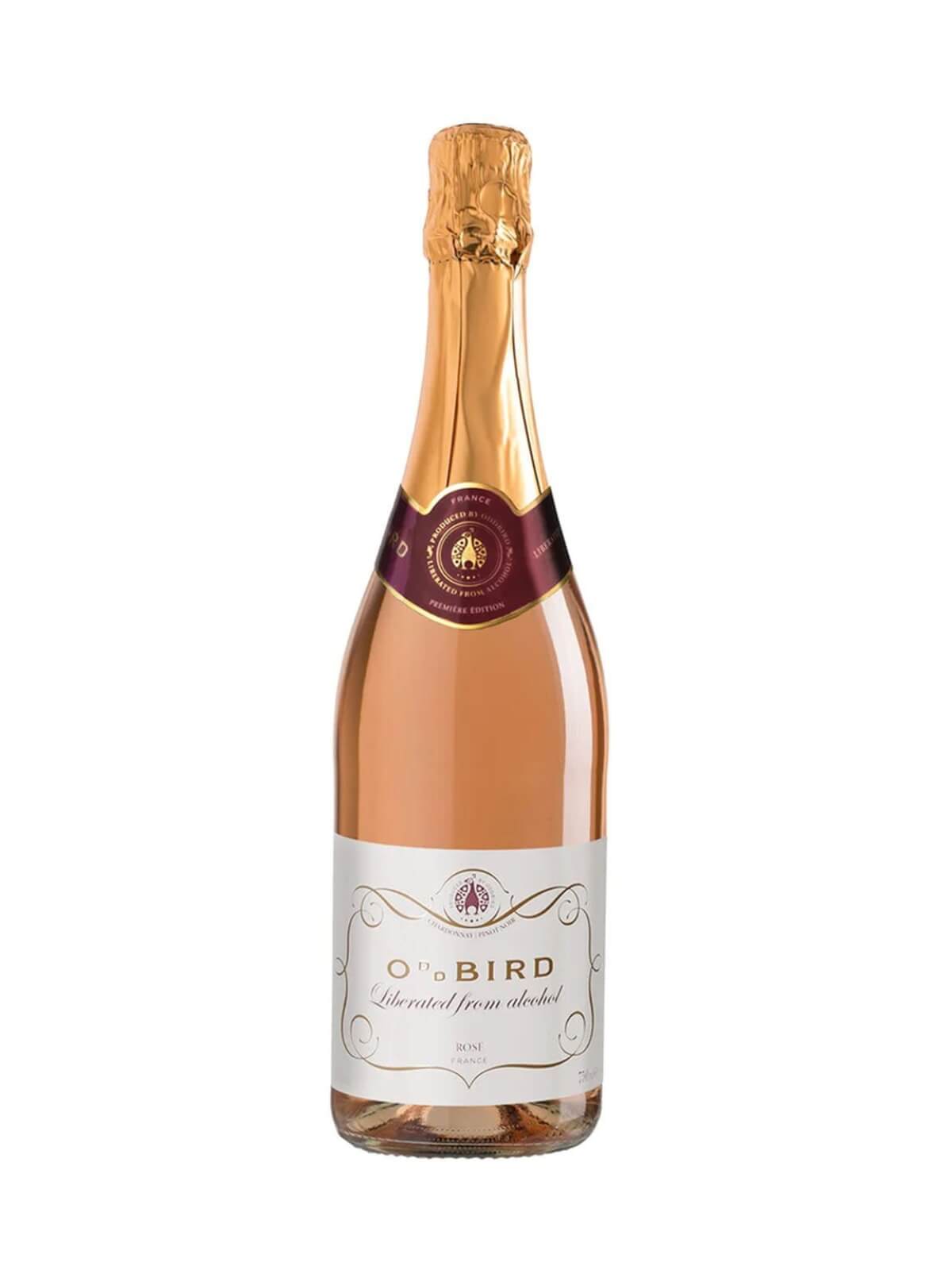 a bottle of oddbird non-alcoholic sparkling rosé on a white background, the sparkling wine is pink with a gold top and writing on the bottle.