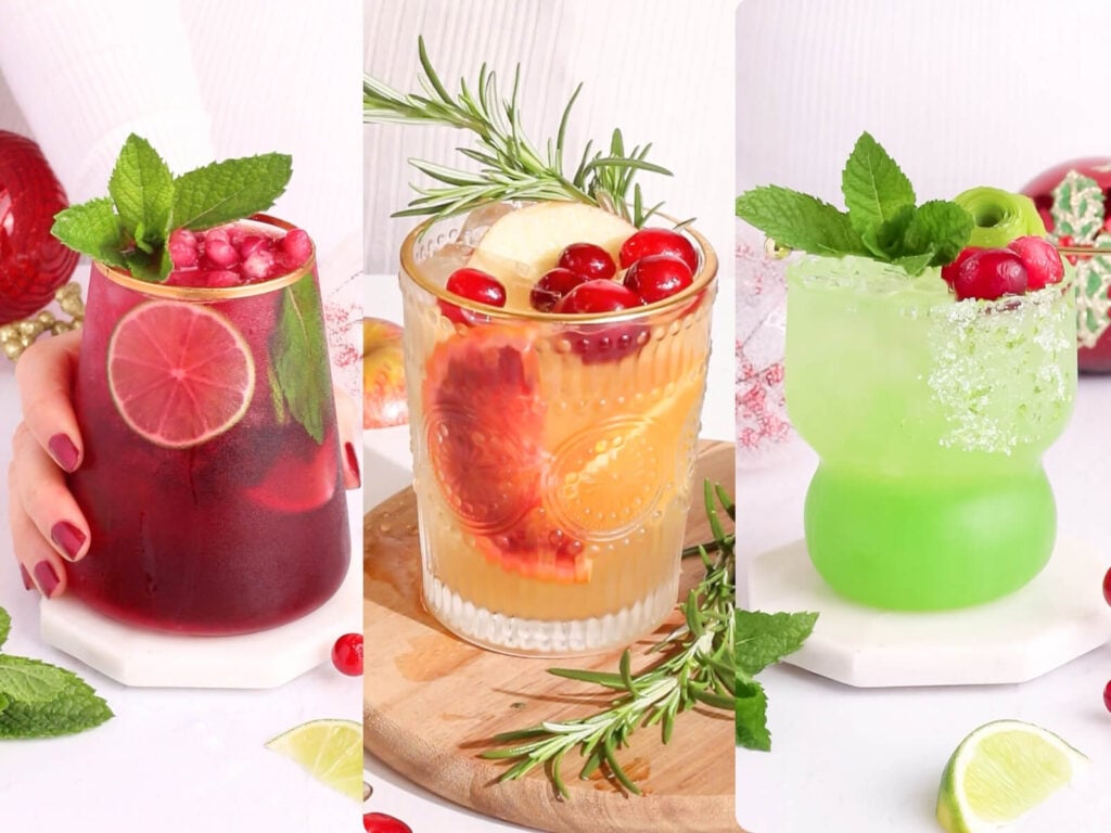 A collage of three festive Christmas batch mocktails in decorated glasses: a red drink with lime and mint, an orange drink with cranberries, apple, and rosemary, and a green drink with mint, lime, and cranberries, all set against a white background.