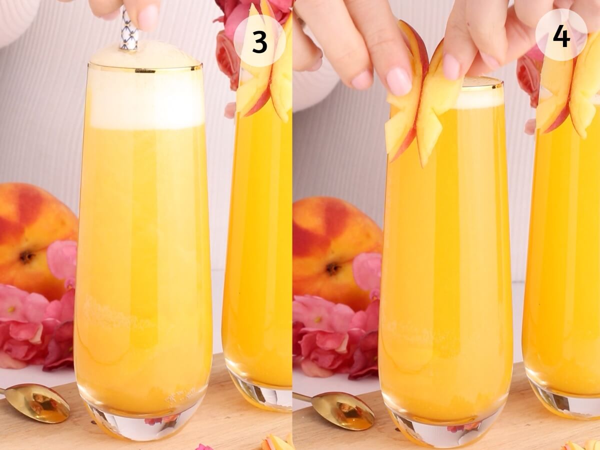Two tall glasses of peach-colored drink are decorated with peach slices on top. A peach and pink flowers are in the background. One hand is cutting a peach, while another is placing slices on the glass rim.