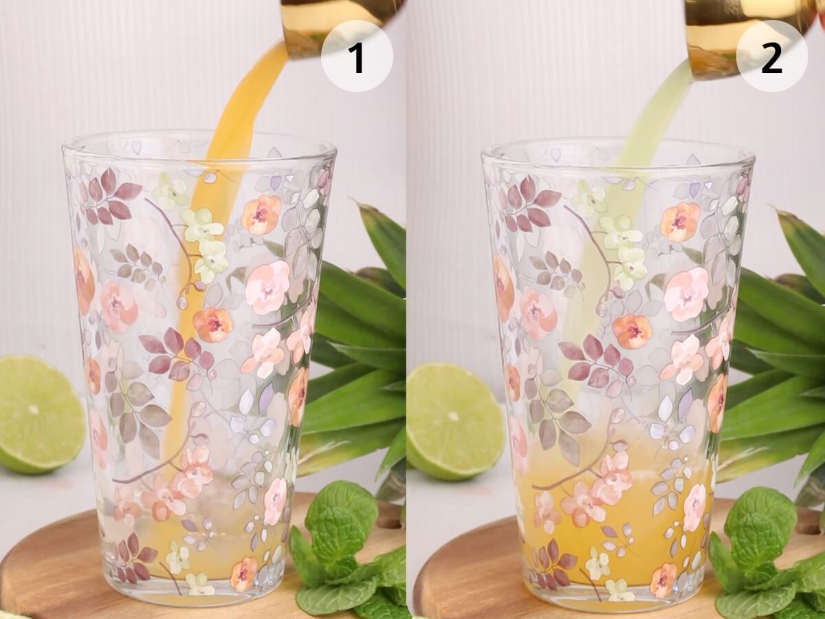 Side-by-side images of a floral glass. In image 1, orange juice is being poured in; in image 2, a light green liquid is being added to the same glass. A lime, pineapple, and mint leaves are in the background.