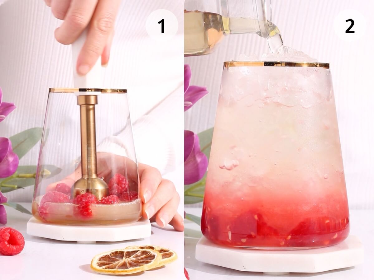 Side-by-side images: On the left, a hand uses a muddler to mash raspberries and lemon slices in a glass. On the right, a clear liquid is poured into the same glass over crushed ice and muddled fruit. Purple flowers are in the background.